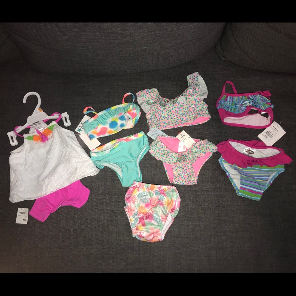 4 swim suits and one swim diaper